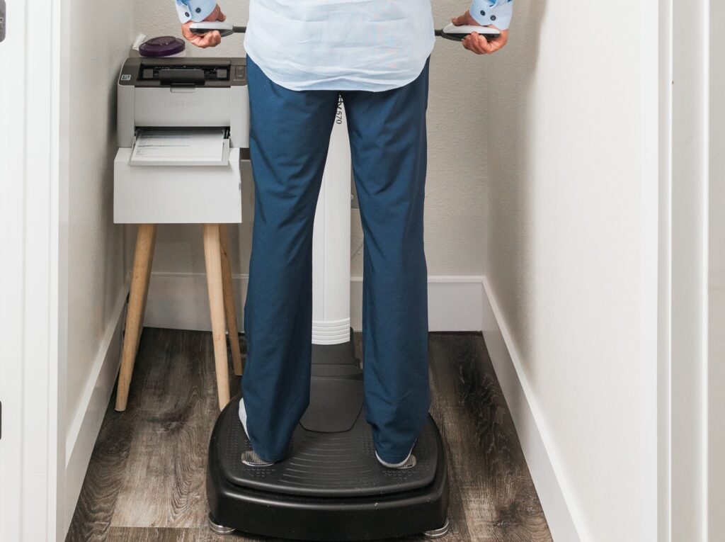 A man stands on the InBody Scale to get more information on his weight, fat percentage, muscle mass, and more, before taking a weight loss injection in Mansfield.